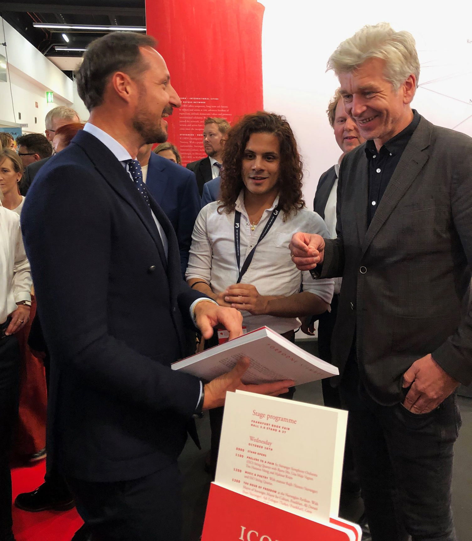 The Crown Prince of Norway, Haakon Magnus, was given a copy of Forbidden Voices by Karl Ove Knausgård while visiting the ICORN stand pre-launch of the book. He met cartoonist Ali Dorani, aka Mr. Eaten Fish, who told his own story about his 4 years in an Australian run detention camp in Manus Island. Photo. 