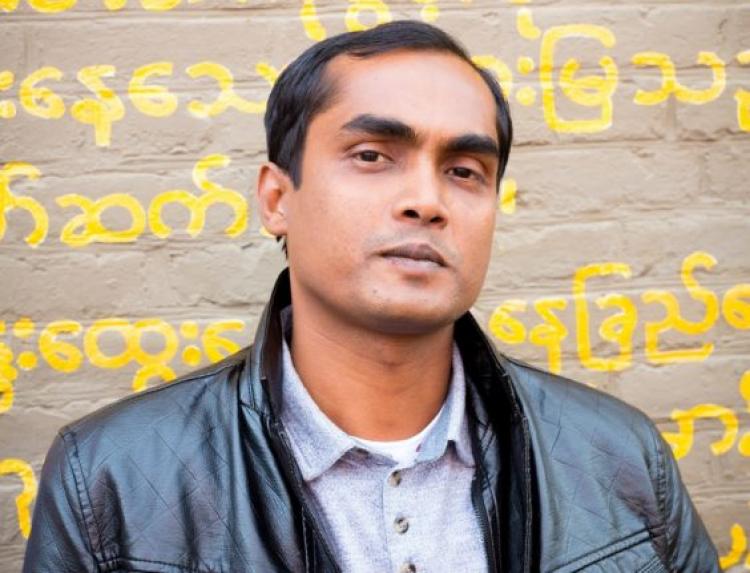Tuhin Das, current ICORN writer-in-residence of City of Asylum in Pittsburgh, stands in front of Burma House on Sampsonia Way in Pittsburgh. Photo by Renee Rosensteel. All rights reserved, Sampsonia Way Magazine. Photo.